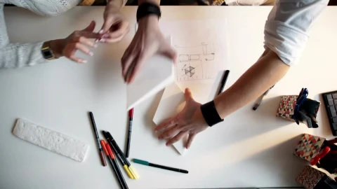 Free Video Stock top view of creative hands working on paper models and Live Wallpaper – Free Live Wallpaper
