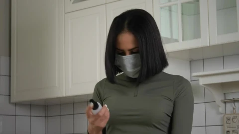 Free Stock Video Woman Using The Hand Sanitizer In The Kitchen Live Wallpaper - Stock Wallpaper