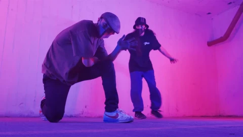 Stock Footage Two Young Men With Face Masks Dancing Hip Hop Under Live Wallpaper animated wallpaper preview