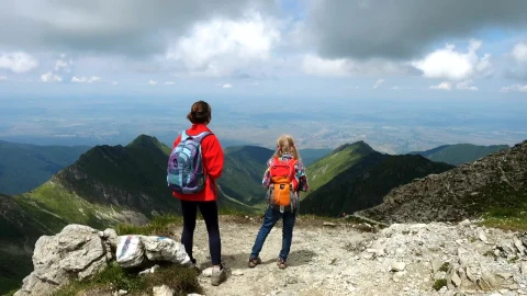 Stock Footage Two Girls Enjoying The View In The Mountain Live Wallpaper animated wallpaper preview