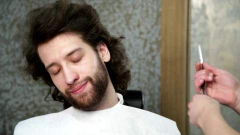 Stock Footage Trimming A Beard With A Razor Close Up Live Wallpaper animated wallpaper preview