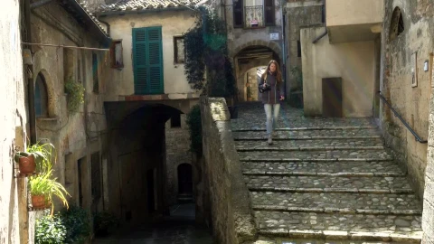 Stock Footage Woman Walking Down The Stairs Of An Ancient City Live Wallpaper Free animated wallpaper preview