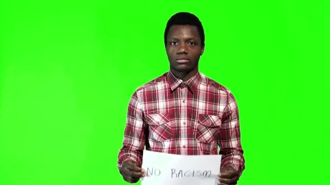 Stock Footage Young Man Holding A Sign Of No Racism Live Wallpaper Free - Wallpaper Wallpaper