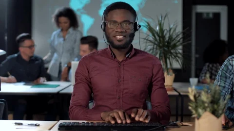 Stock Footage Worker In Front Of The Computer With Headset Live Wallpaper Free - Wallpaper Wallpaper
