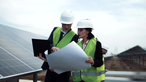 Stock Footage Workers Checking A Blueprint In The Solar Field Live Wallpaper Free - Wallpaper Wallpaper