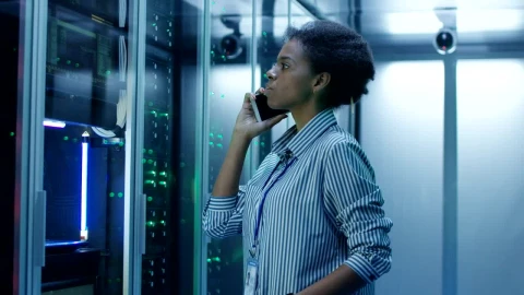 Stock Footage Woman On A Phone Call On Data Center Live Wallpaper Free - Wallpaper Wallpaper