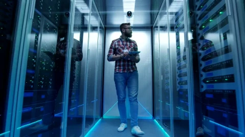 Stock Footage Young Engineer Walking Through Data Center Live Wallpaper Free - Wallpaper Wallpaper