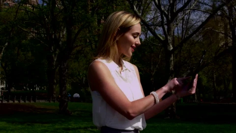 Stock Footage Woman Taking Photos In A City Park Live Wallpaper Free - Wallpaper Wallpaper