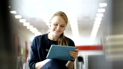 Stock Footage Woman Using A Tablet In A Waiting Room Live Wallpaper Free - Wallpaper Wallpaper