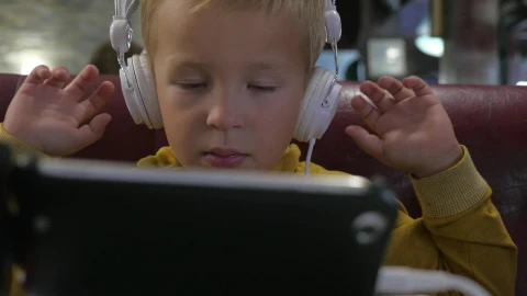 Stock Footage Young Boy Watching Cartoons On A Tablete Live Wallpaper Free - Wallpaper Wallpaper