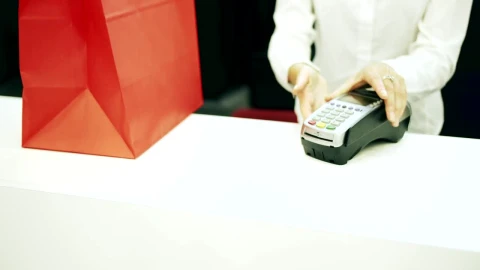 Stock Footage Woman Pays Cashier With Credit Card In Shop Live Wallpaper Free - Wallpaper Wallpaper