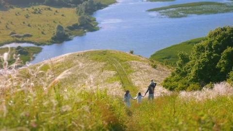 Stock Footage Young Family Walking Down The Hill With A Lake In Live Wallpaper Free - Wallpaper Wallpaper