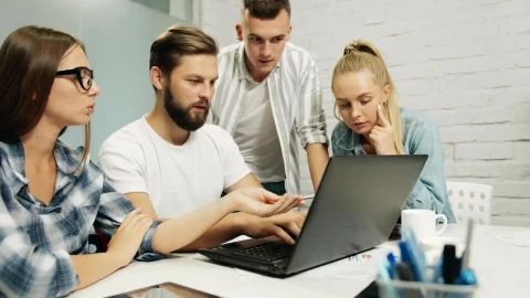 Stock Footage Young Marketing Team Gather Around Laptop Live Wallpaper Free - Wallpaper Wallpaper