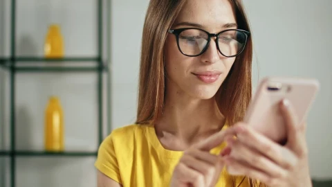 Stock Footage Young Woman Using Smartphone App Touchscreen Live Wallpaper Free animated wallpaper preview