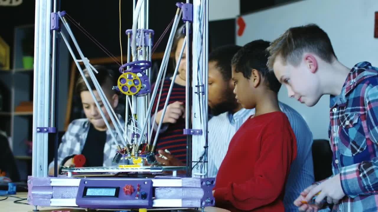 Download Stock Video 3 d printer in action in kids classroom PC Live Wallpaper