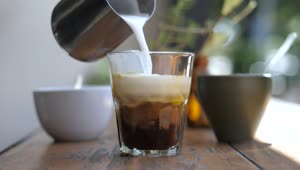 Download Stock Video A Barista Preparing Coffee With Milk And Ice Live Wallpaper for PC