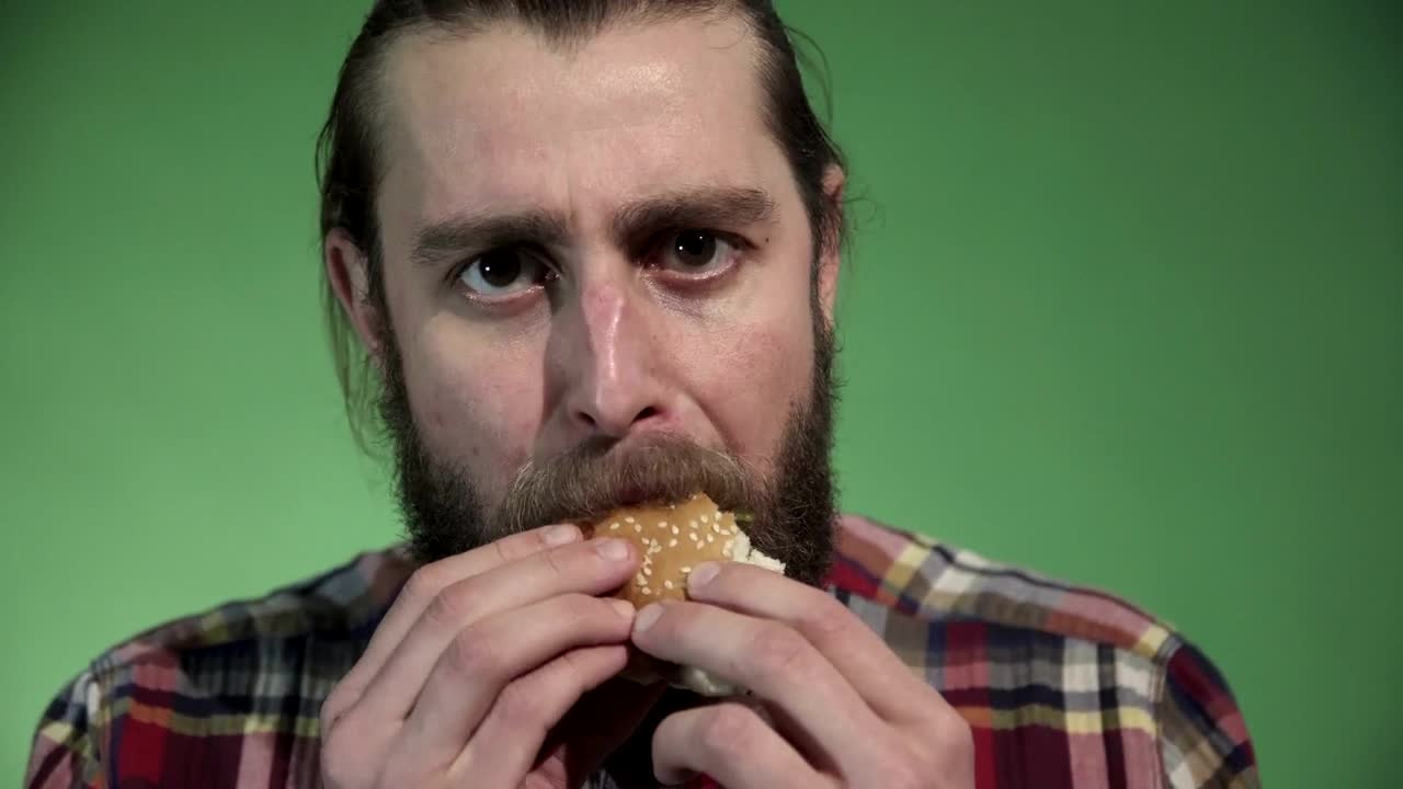 Download Stock Video A Bearded Man Eating A Burger Live Wallpaper for PC