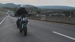 Stock Video A Biker Speeding Up On A Highway Live Wallpaper for PC
