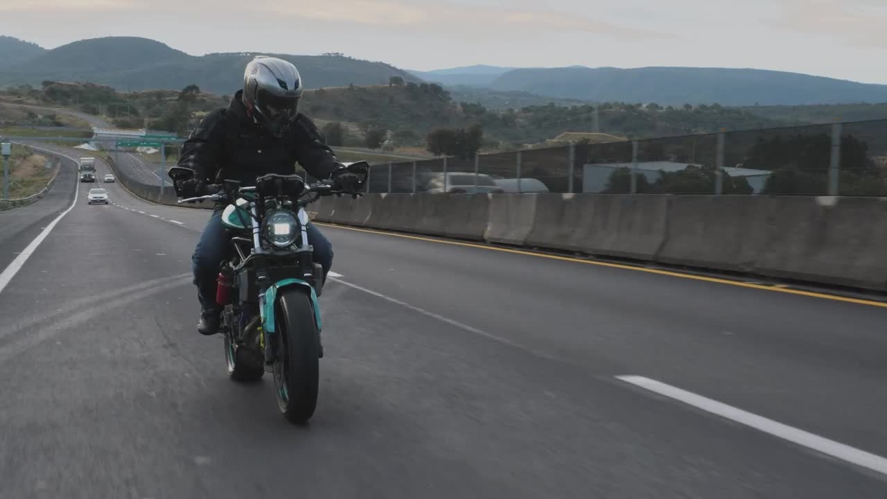 Download Stock Video A Biker Speeding Up On A Highway Live Wallpaper for PC