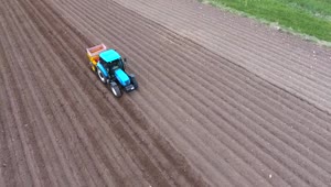 Stock Video A Blue Tractor Working On The Fields Live Wallpaper for PC