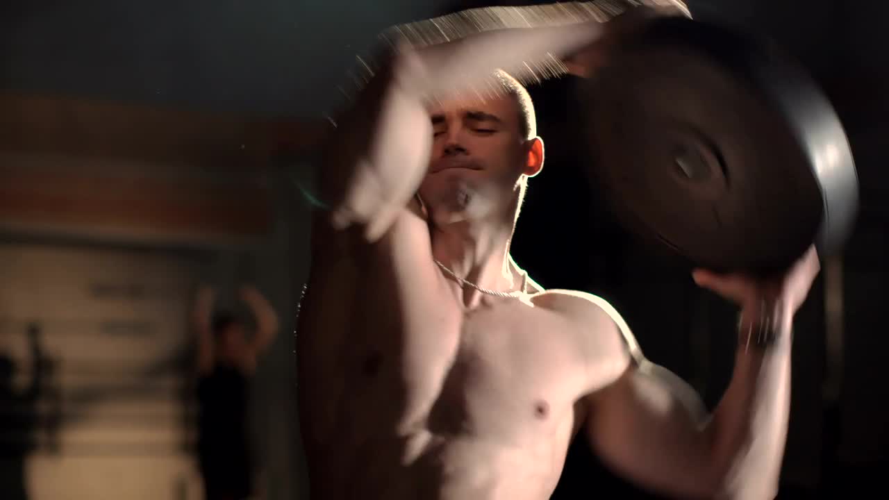 Download Stock Video A Bodybuilder Warms Up With The Weight Live Wallpaper for PC