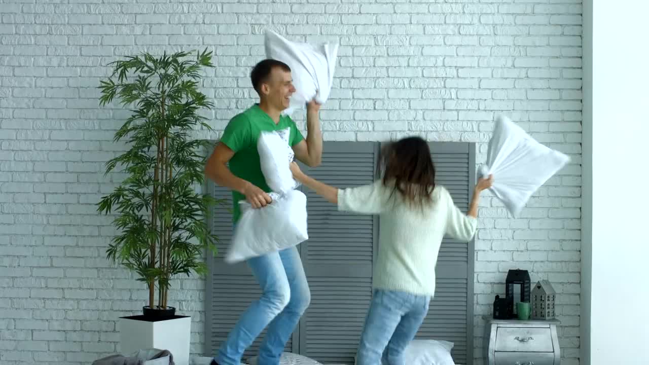 Download Stock Video A Boy And A Girl Fighting With Pillows Live Wallpaper for PC