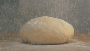 Stock Video A Chef Covering Dough With Flour Live Wallpaper for PC