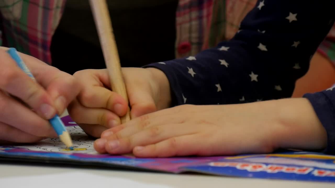 Download Stock Video A Child Using A Coloring Book Live Wallpaper for PC