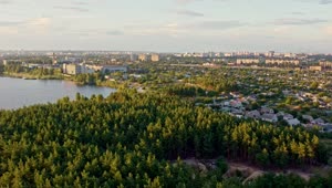 Stock Video A City By A Forest And A Lake Aerial Shot Live Wallpaper for PC