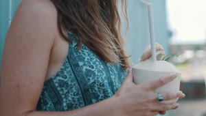 Stock Video A Coconut Water Being Enjoyed By A Woman Live Wallpaper for PC