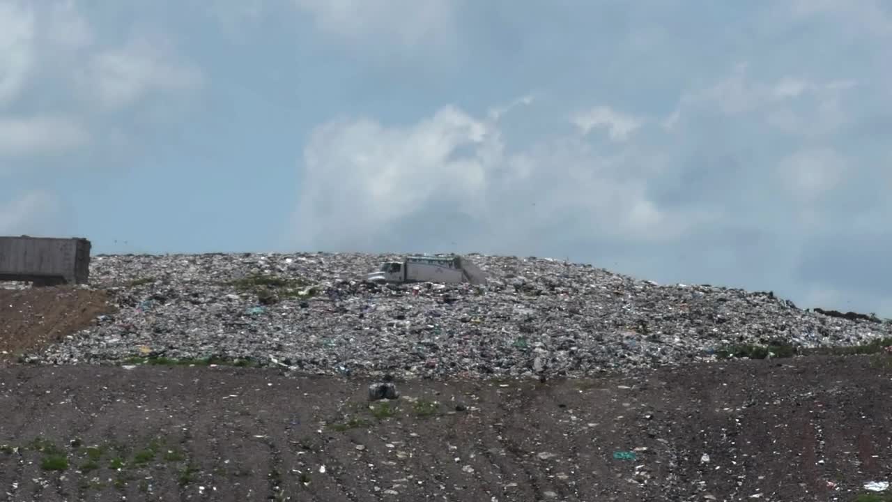 Download Stock Video A Couple Of Trucks Crossing A Hill In A Dump Live Wallpaper for PC