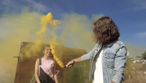 Stock Video A Couple Playing With A Yellow Smoke Bomb Live Wallpaper for PC