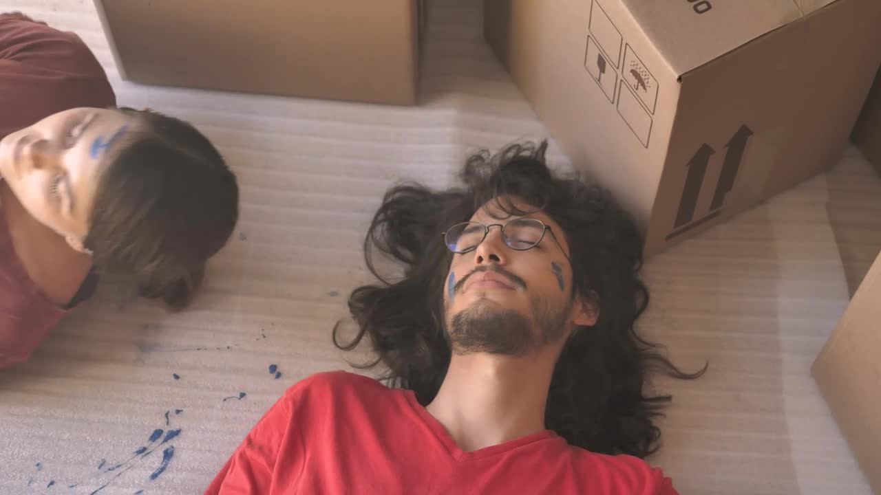 Download Stock Video A Couple Resting Lying In The Floor Live Wallpaper for PC