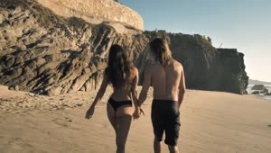 Stock Video A Couple Walking On The Beach Live Wallpaper for PC