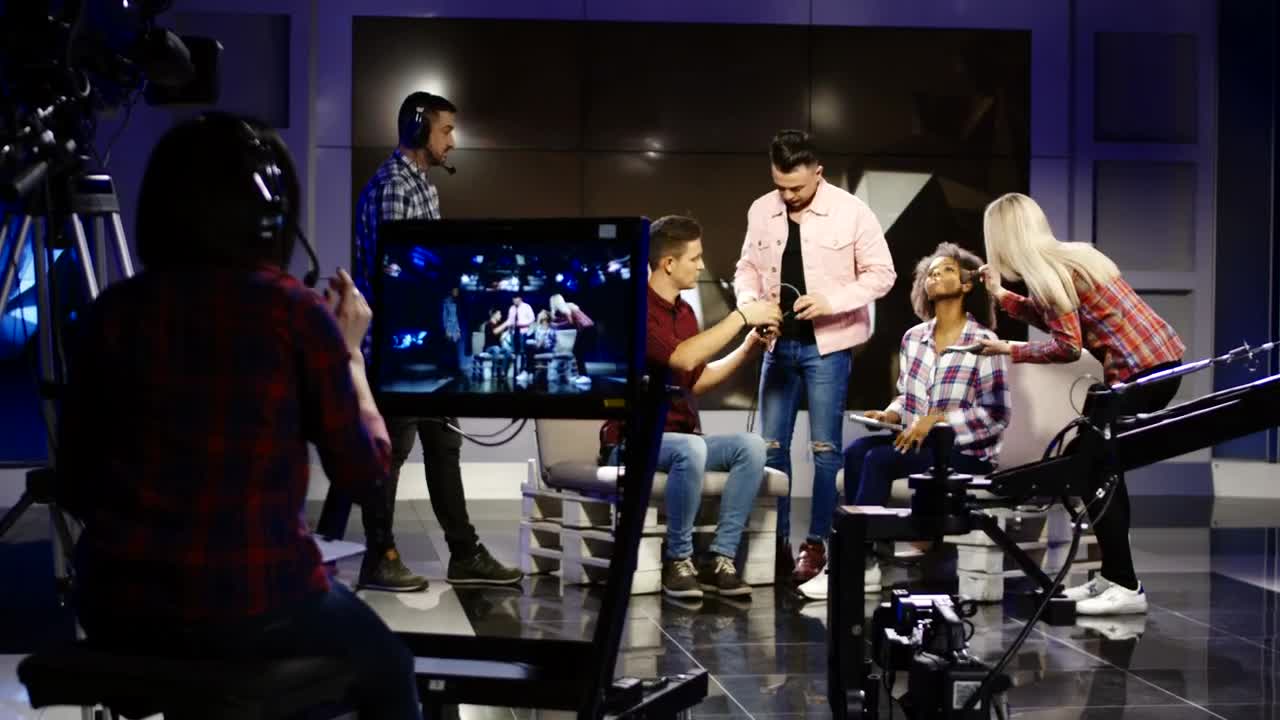 Download Stock Video A Crew In A Television Studio Getting People Ready Live Wallpaper for PC
