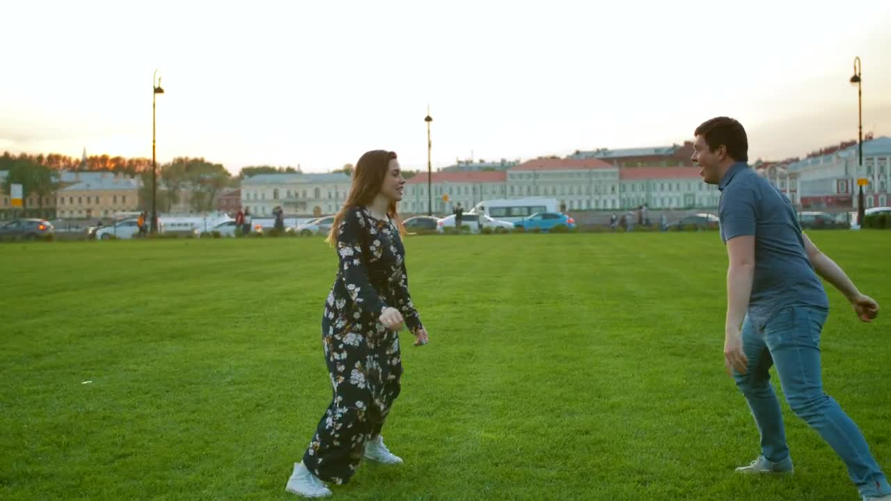 Download Stock Video A Cute Couple Playing On The Grass Live Wallpaper for PC