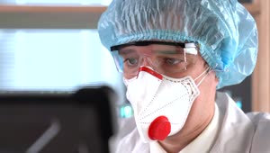 Stock Video A Doctor Wearing A Face Mask And Protection Glasses Live Wallpaper for PC