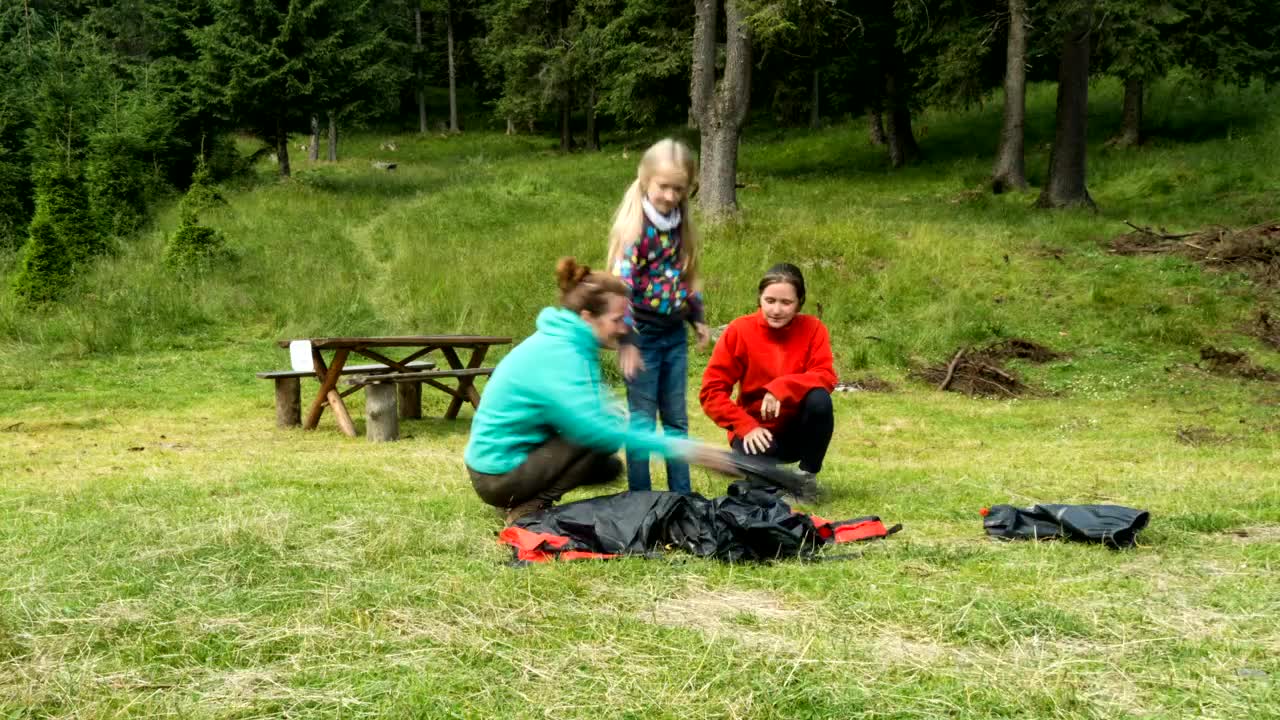 Download Stock Video A Family Setting Up A Camping Tent Live Wallpaper for PC