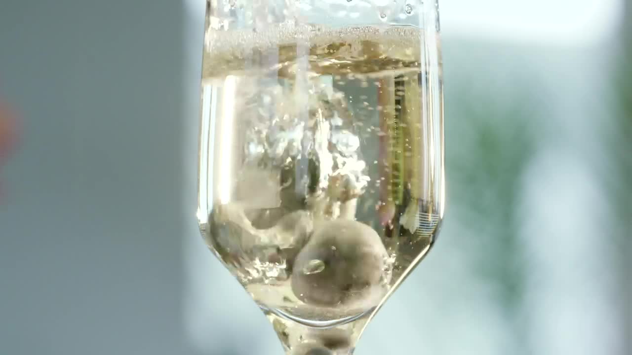 Download Stock Video Adding Blueberries To A Champagne Glass Live Wallpaper for PC