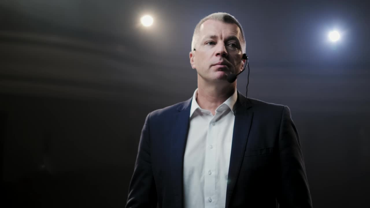 Download Stock Video Adult Man With Headset Microphone On Stage Live Wallpaper for PC