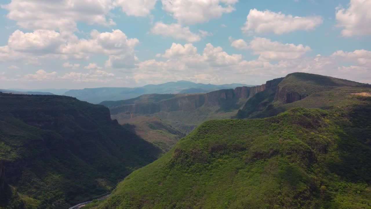Download Stock Video Aerial Landscape Of A Canyon Covered With Vegetation Live Wallpaper for PC