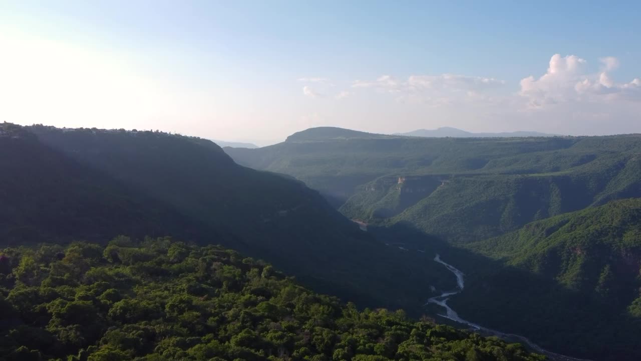 Download Stock Video Aerial Landscape Over A Vegetation Covered Canyon Live Wallpaper for PC