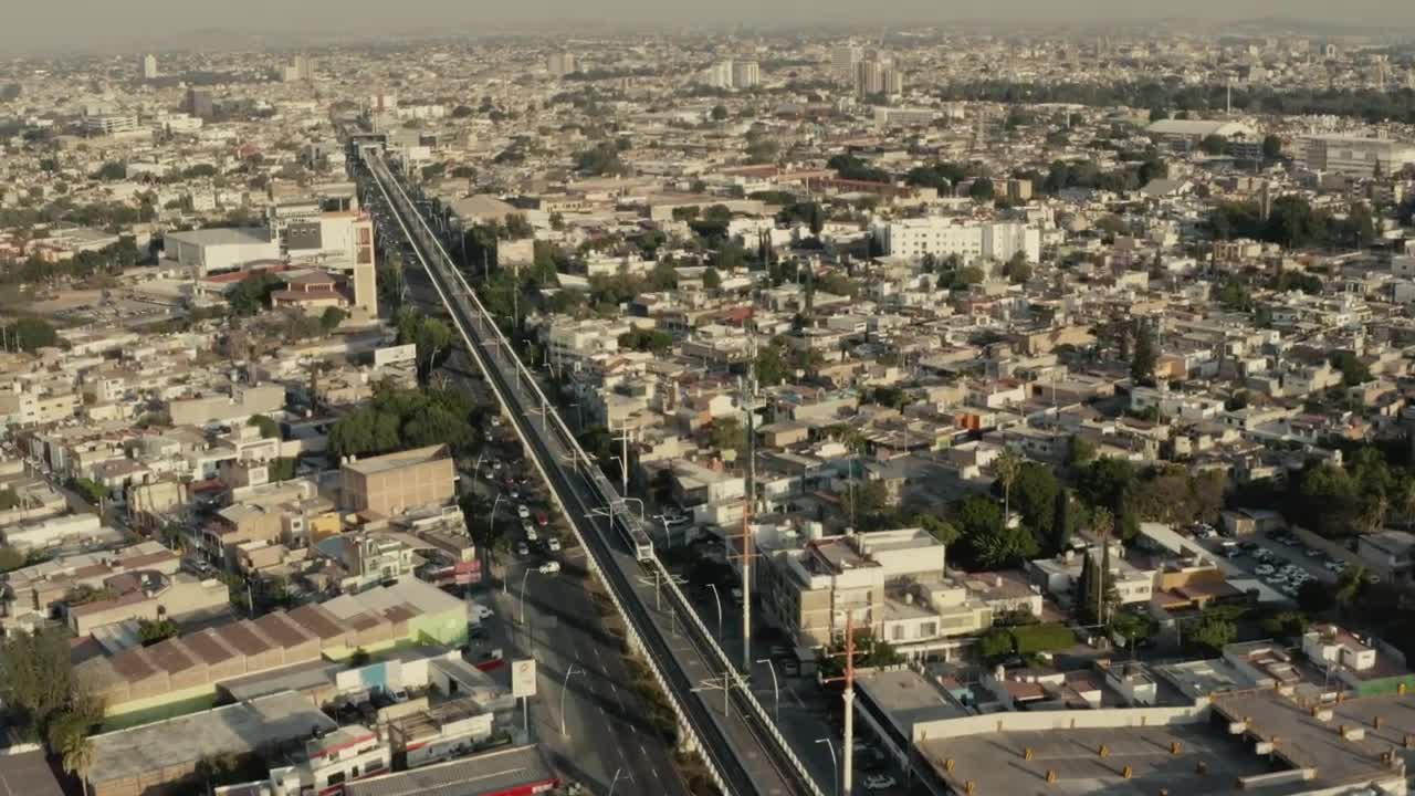 Download Stock Video Aerial Panorama Of A Train Crossing A Big City Live Wallpaper for PC