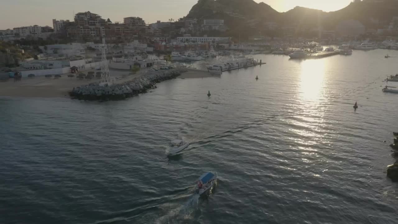 Download Stock Video Aerial Shot Of A Boat Moving Away From A Coast Live Wallpaper for PC