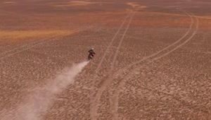 Stock Video Aerial Shot Of A Motorcyclist In The Desert Live Wallpaper for PC