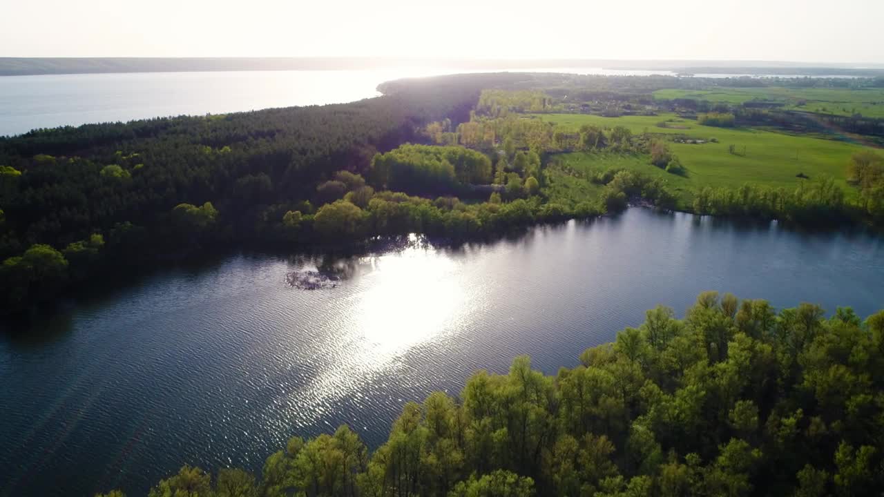 Download Stock Video Aerial Shot Of A River Crossing The Field In Spring Live Wallpaper for PC