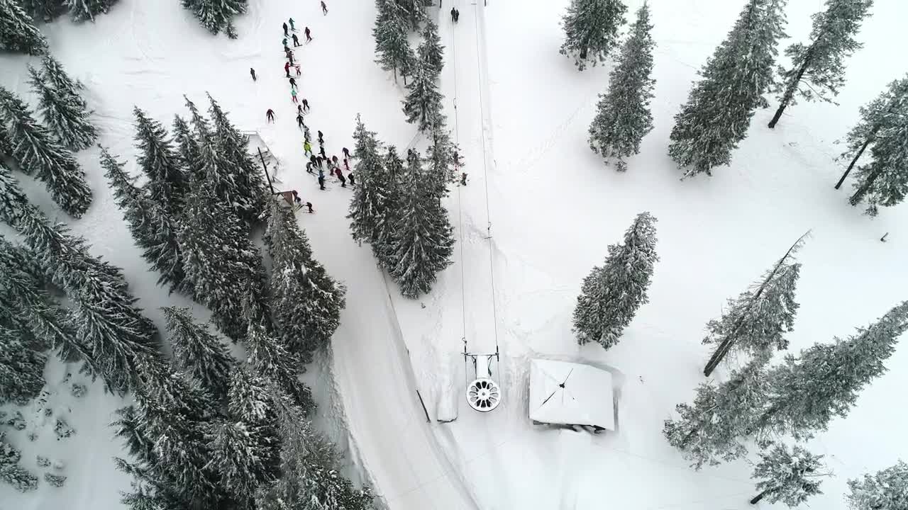 Download Stock Video Aerial Shot Of A Ski Station With People Practicing Live Wallpaper for PC