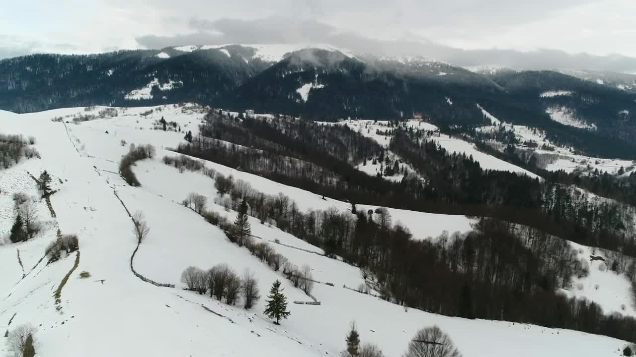 Download Stock Video Aerial Shot Over Foggy Frozen Mountains Live Wallpaper for PC