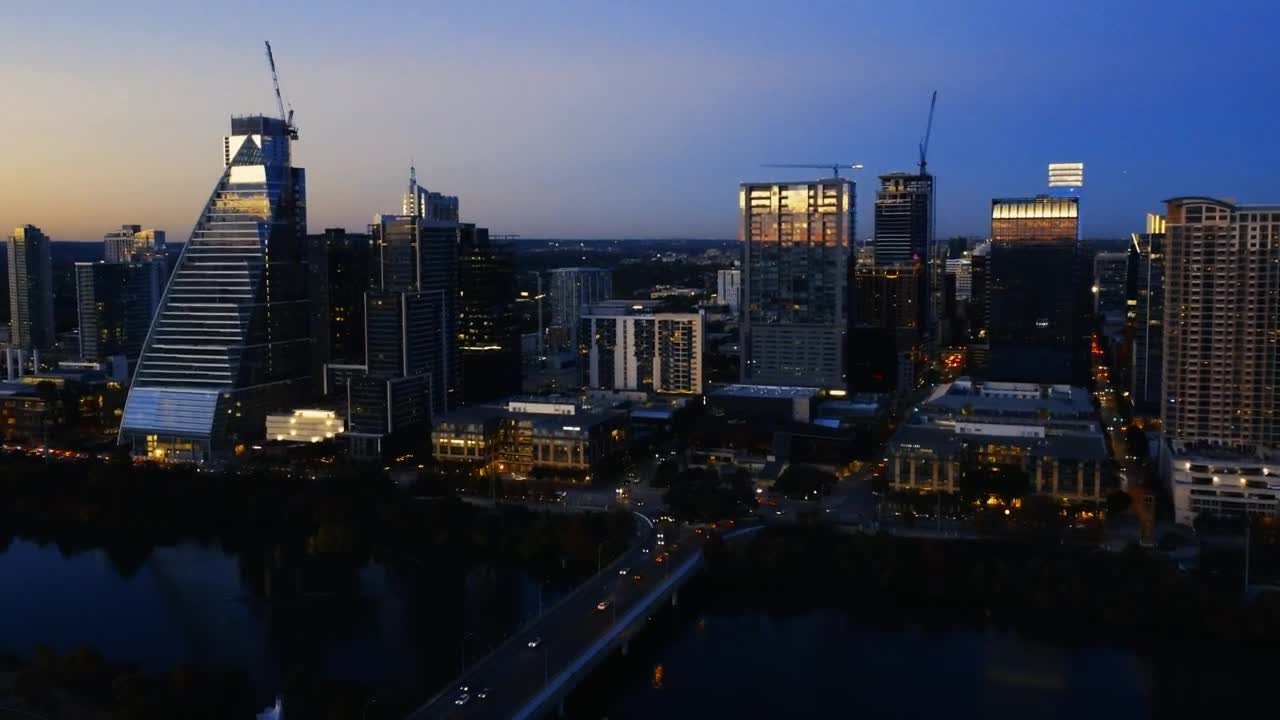 Download Stock Video Aerial Tour Over A Big City At Dusk Live Wallpaper for PC