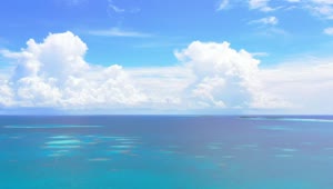 Stock Video Aerial View Of A Blue Sea With Big Clouds Live Wallpaper for PC